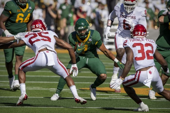 Baylor running back Abram Smith (7) tries to elude Oklahoma defensive backs Justin Broiles (25) and Delarrin Turner-Yell (32). Mandatory Credit: Jerome Miron-USA TODAY